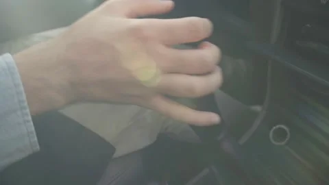 Young hispanic unrecognizable businessman changing gear while driving Stock Footage 201202577