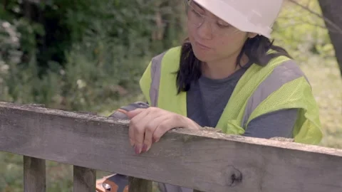 Young hispanic women using drill wearing hardhat and safety glasses Stock Footage 248001395