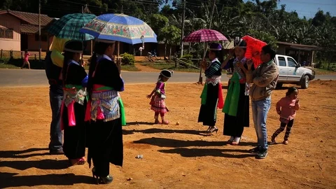 Young Hmong locals throwing the ball to each other in tradition with kids  Stock Footage 104120949