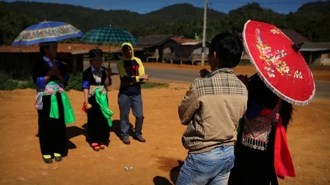 Young Hmong locals throwing the ball to each other in tradition Stock Footage 104120987