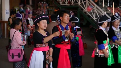 Young Hmong throwing the ball to each other in tradition in Laos Stock Footage 104120668