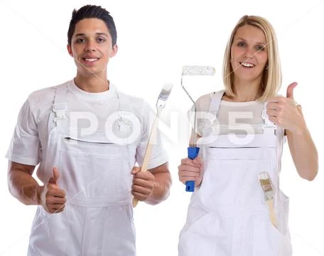 Young house painters and decorators apprentice thumbs up trainees woman man.. Stock Photos