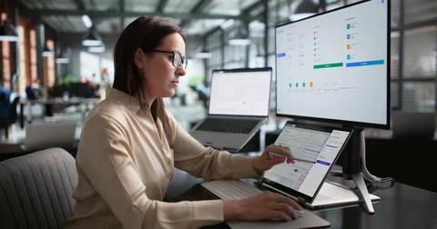 Young HR Manager Is Using Software On Laptop For Payroll Processing. Stock Photos
