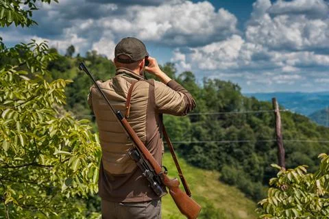 Young hunter checking his surrounding for prey Stock Photos