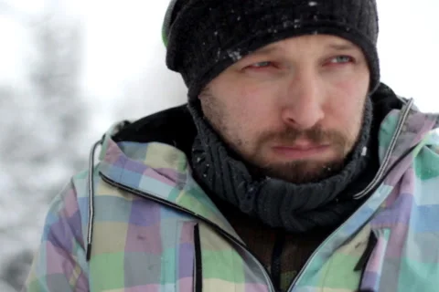 Young ill man coughing, outdoors, winter time Stock Footage