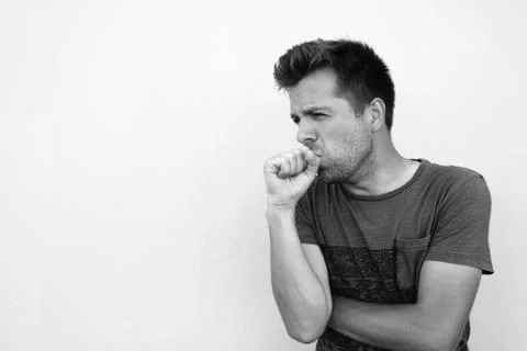 Young ill man on grey background Stock Photos