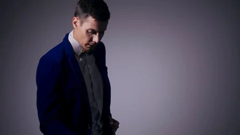 Young illusionist performing tricks with fidget spinner Stock Footage 80117831