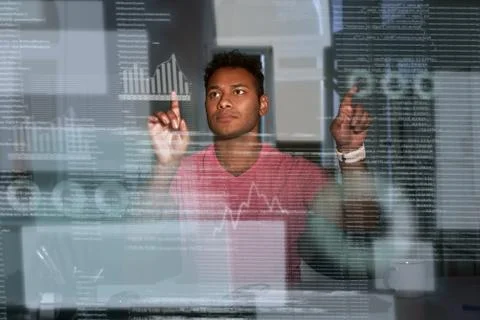 Young indian analyst is comparing data and make conclusions Stock Photos