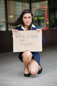 Young Indian businesswoman holding 'Will Work for Food' sign Stock Photos