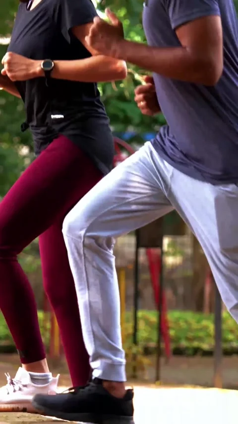 Young Indian couple doing step workout together in outdoor park outdoors Stock Footage 342843727