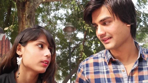 Young Indian couple hanging outdoor Stock Footage 59369396