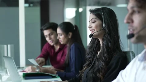 Young Indian group of operator man and woman working with headset . Видео 170123792