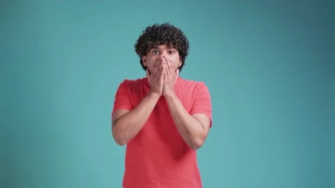 Young Indian handsome man looking happy and excited, shocked with an unexpected Stock Footage 238679571