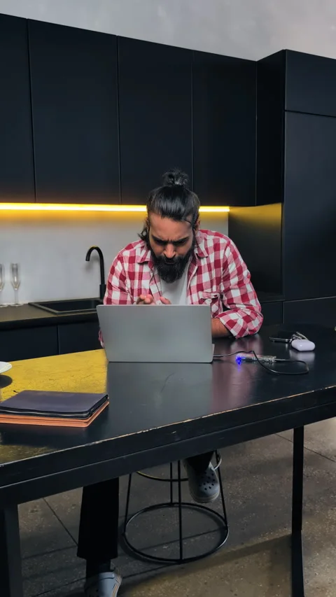 Young Indian IT developer working on laptop, smiling at good news email result Video stock 316838629