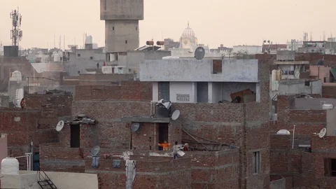 Young Indian Kids Playing Unsupervised On Roof Top of Town Houses Stock Footage 129586733