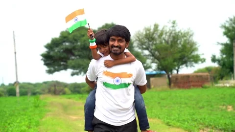 Young indian man and his child with indian flag and celebrating National Da.. Stock Footage 280840181