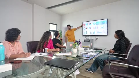 Young indian man entrepreneur present business financial data on TV display.. Stock Footage 290291753