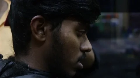 Young indian man getting his haircut Video stock 59998864