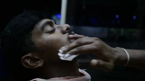 Young indian man getting shaving foam on his cheek Stock Footage 59999636