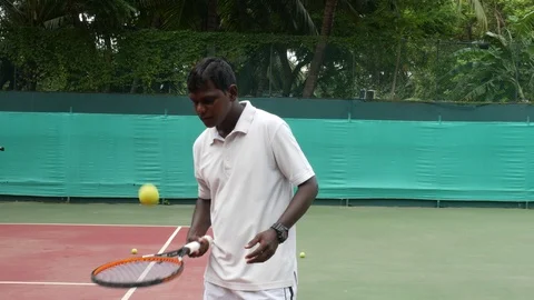 Young Indian Man practicing tennis Stock Footage 94225530