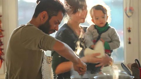 Young Indian man preparing lunch in the kitchen for his family Stock Footage 35174158