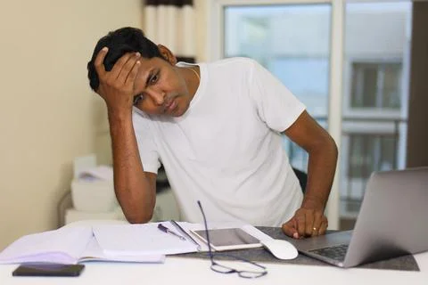 Young Indian Man Stressed by Work Stock Photos