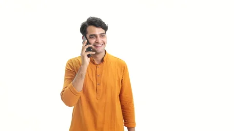 Young Indian man talking on the mobile phone and smiling. 動画素材 253263057