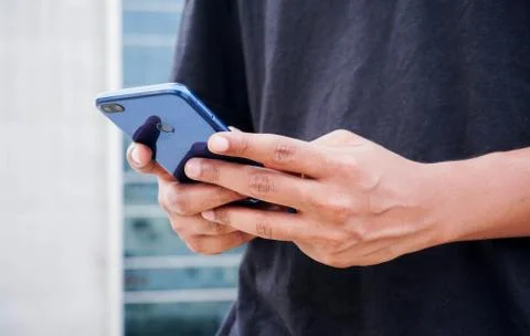 Young Indian man using smartphone Stock Photos