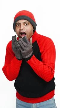 Young Indian Man Wearing a Woolen Sweater, Hand Gloves and Cap, Winter Season Stock Photos