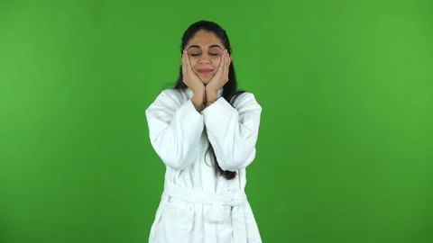 Young Indian model touching her face with clean hands after a refreshing faci... Stock Footage 275809700