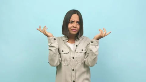 Young indian woman doing a concentration gesture, looking straight ahead focused Stock Footage 138658287