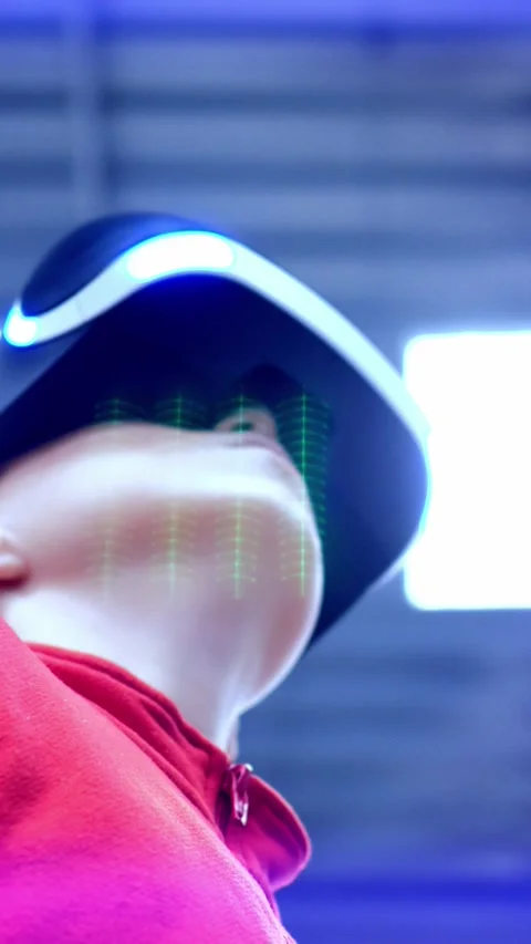 Young individual wearing virtual reality headset is immersed in digital Stock Footage 313257974