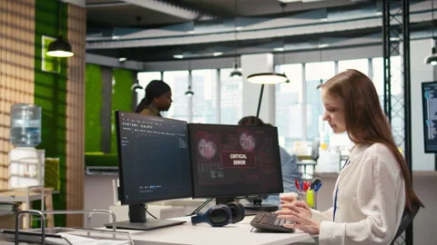 Young inexperienced developer in office struggling to fix critical error Stock Footage 313165067