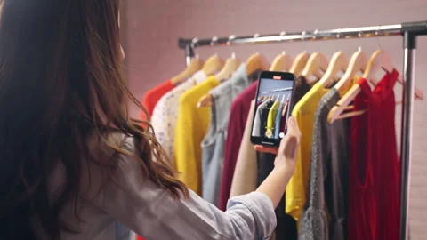 Young influencer creating video content for local store with fashion clothes Stock Footage 301389325