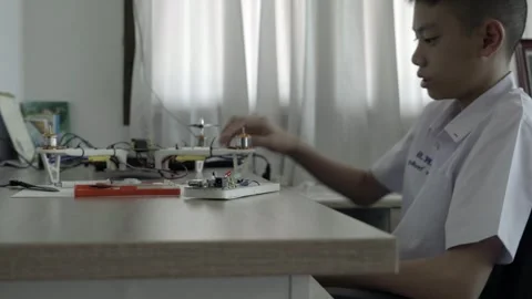 Young Innovator Working on Drone Technology Stock Footage 318863396