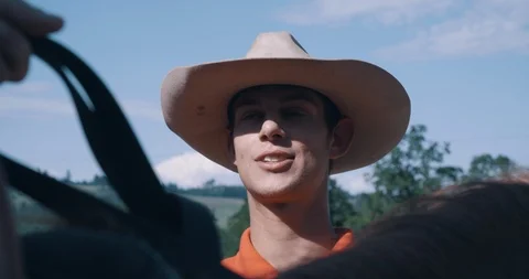 Young instructor explaining riding to horseback student at equestrian lesson Stock Footage 98313585