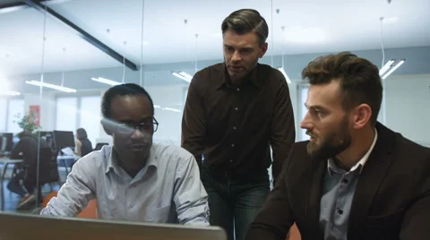 Young intern explaining his business ideas for colleagues Stock Footage 68340882
