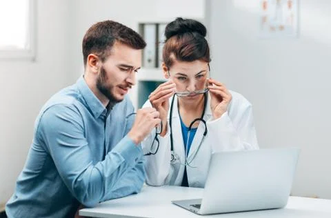 Young Intern at the Hospital Completes Task Stock Photos