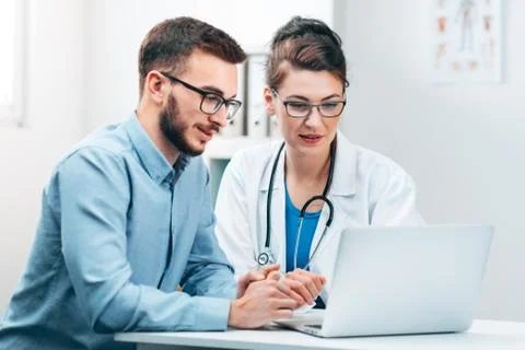 Young Intern at the Hospital Completes Task Stock Photos