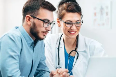 Young Intern at the Hospital Completes Task Stock Photos