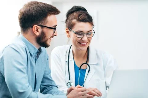 Young Intern at the Hospital Completes Task Stock Photos
