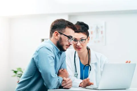 Young Intern at the Hospital Completes Task Stock Photos