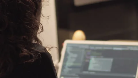 Young IT developer woman coding on her laptop, working remotely, working from Stock Footage 154168841