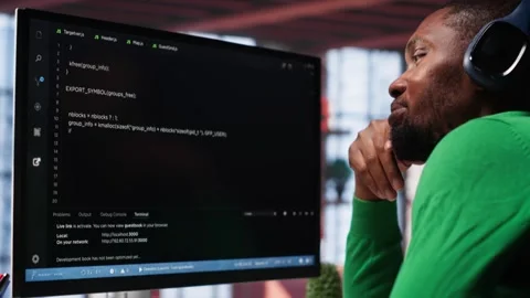 Young IT engineer typing code on computer and running script Stock Footage 309111413