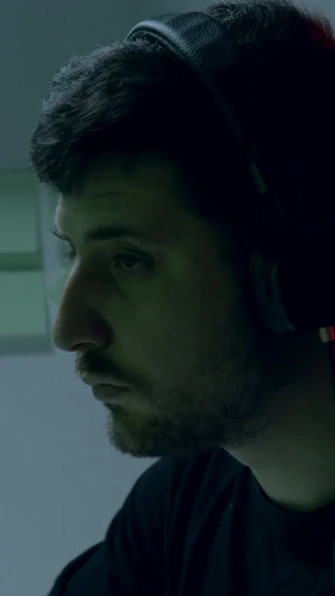 Young IT man with headset on head focused working on creating new and innovative Stock Footage 313926698