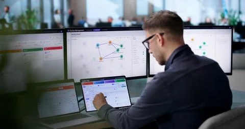 Young IT Manager Monitors User Access Approval Workflow On Cloud Dashboard. Stock Photos