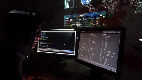 Young IT programmer prints the code on the computer in dark office room Stock Footage 73456239