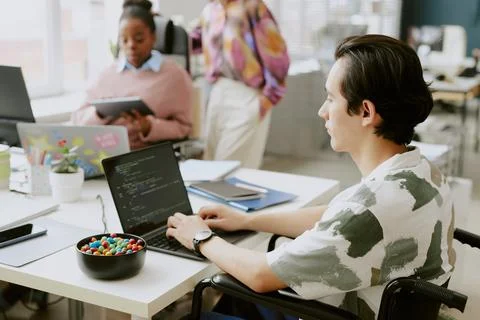Young IT Specialist with Disability at Work 写真素材