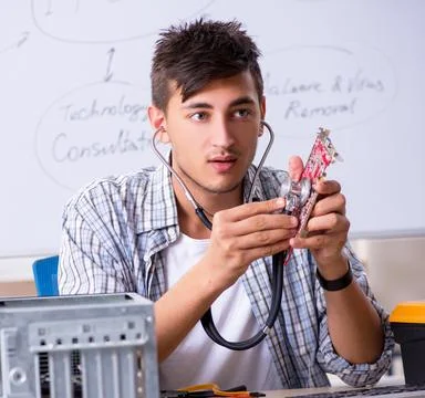 Young it specialist in front of the whiteboard Stock Photos