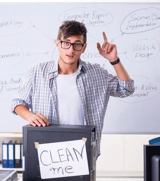 Young it specialist in front of the whiteboard Stock Photos